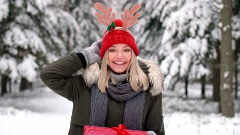 portrait of smiling girl with christmas present