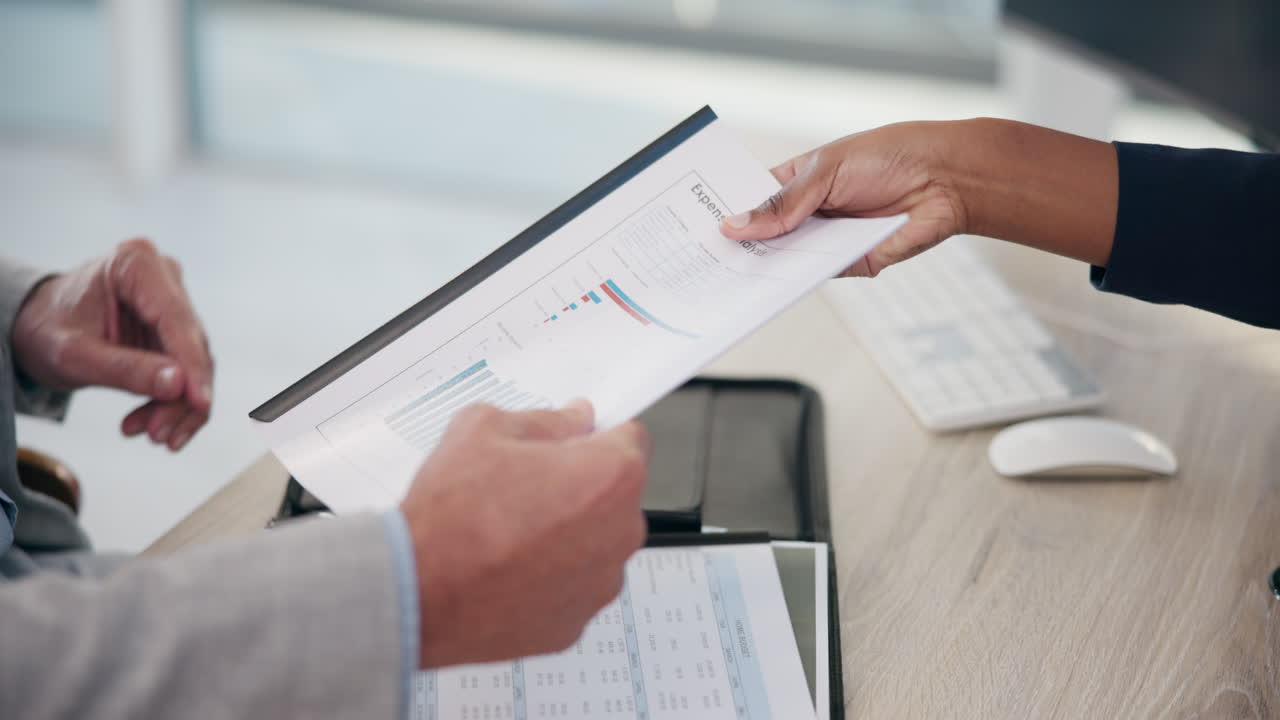 Business meeting with paperwork and analytics