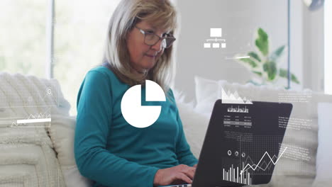 animation of financial data processing over senior caucasian woman using laptop