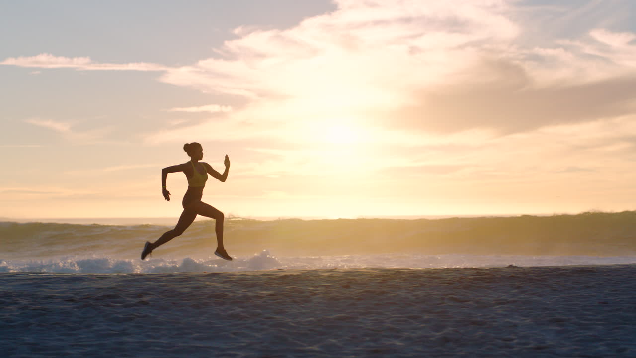 Woman Running on a Beach at Sunset