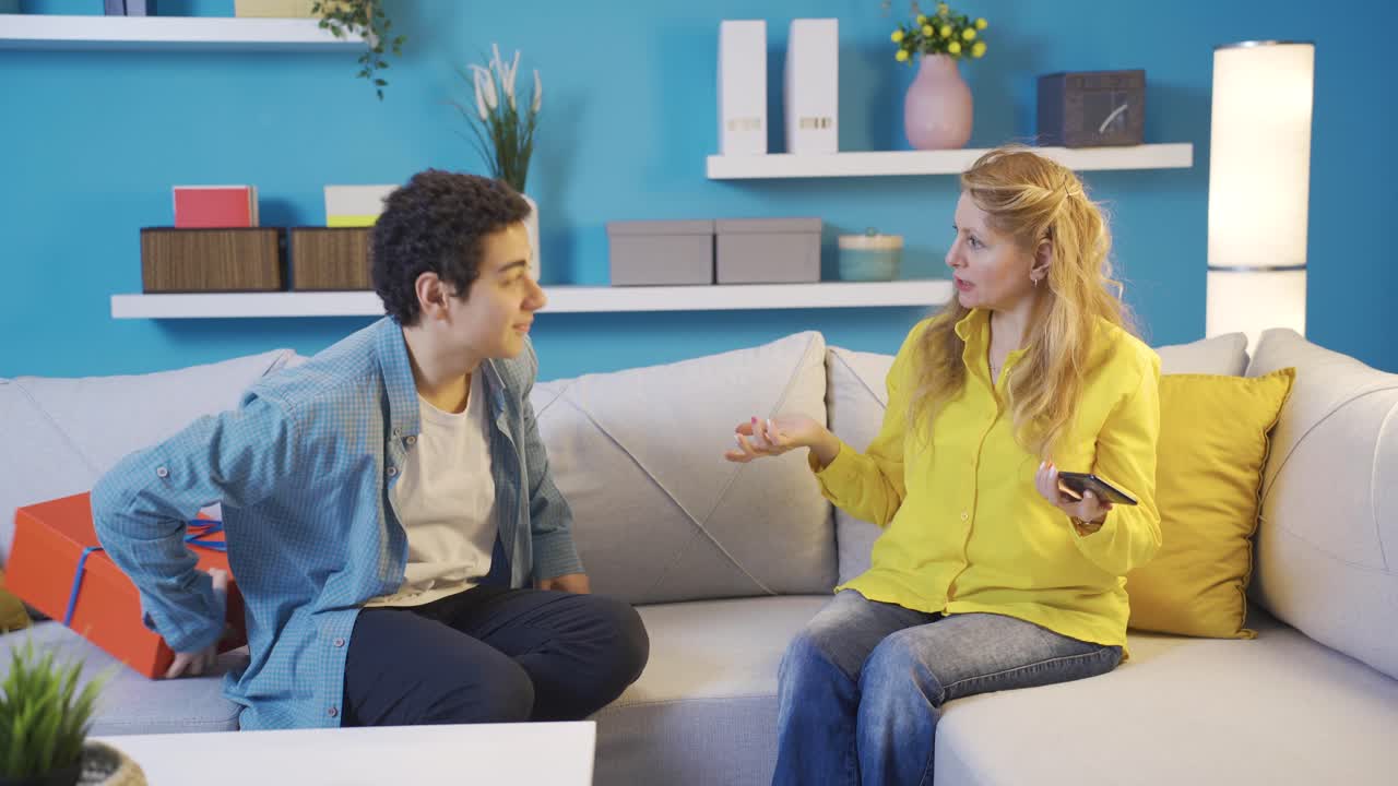 Young man buying a present for his mother. Mother's Day Gift.