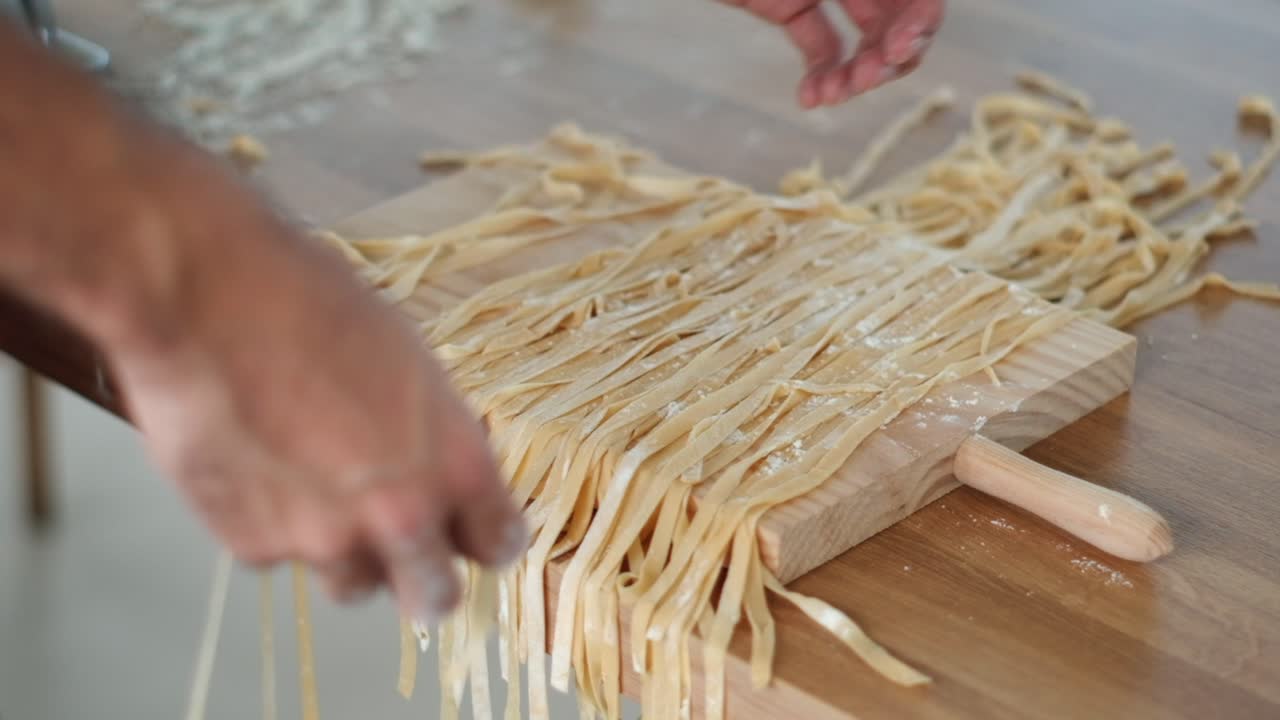 Chef Sorting Tagliatelle in Slow Motion - Flouring Each Strand - 4K Cinematic