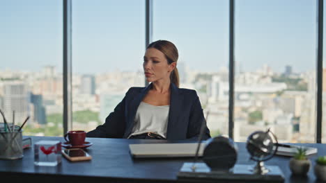 calm businesswoman resting desk at panoramic view. pensive woman taking break