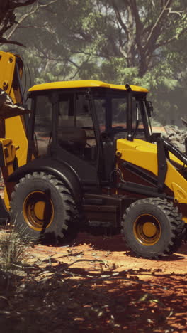 yellow excavator in a natural setting