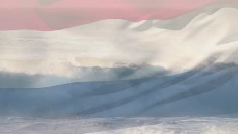 composición digital de ondear la bandera de los países bajos contra las olas en el mar