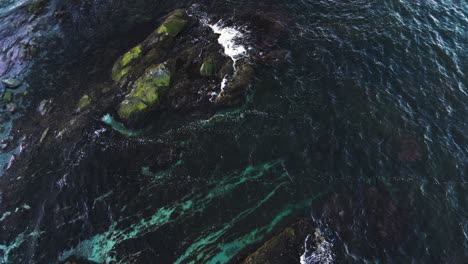 Bird's-eye-view-above-eroded-coastline-of-Newport-Rhode-Island-covered-with-algae