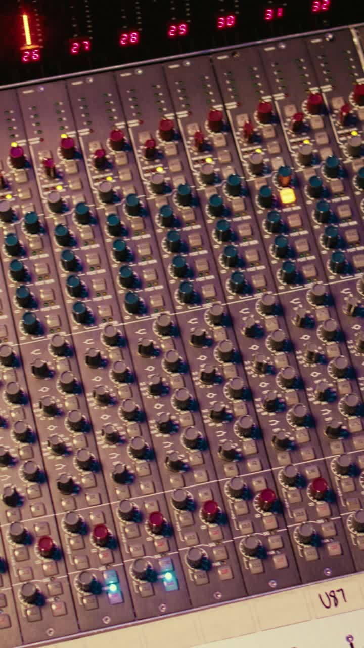 Panning Across a Professional Audio Mixing Console in a Studio