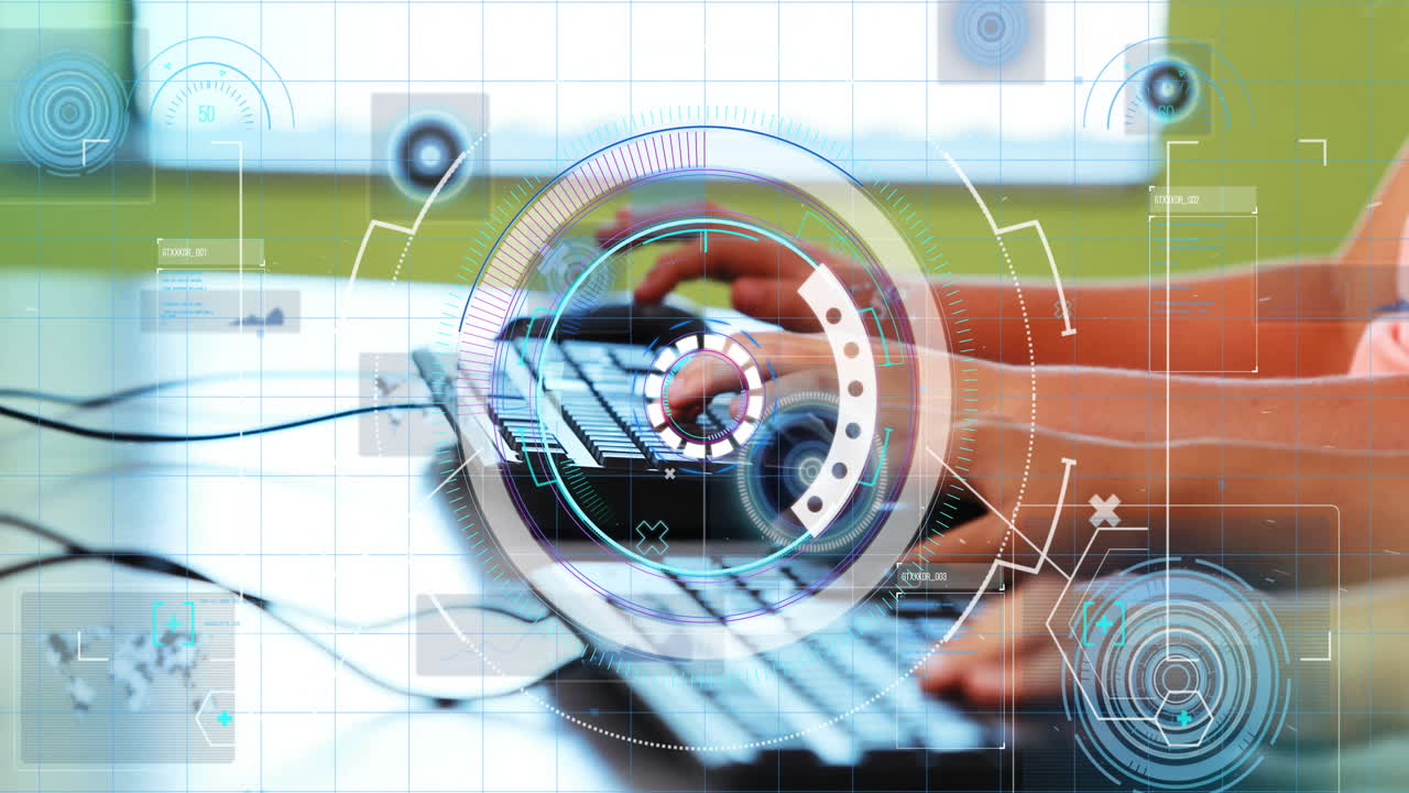 Typing on keyboard with animation of futuristic graphics overlaying screen
