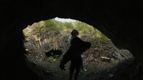 young people jumping in an abandoned tunnel