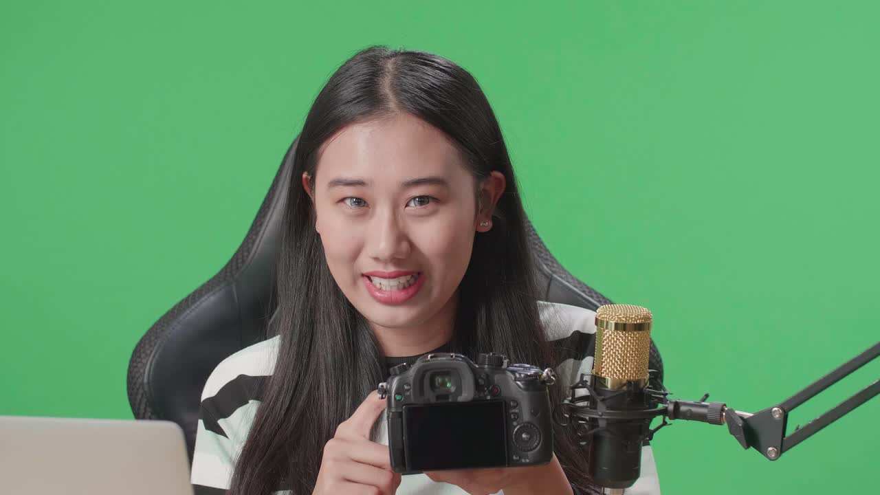 Woman Vlogger Reviewing a Camera