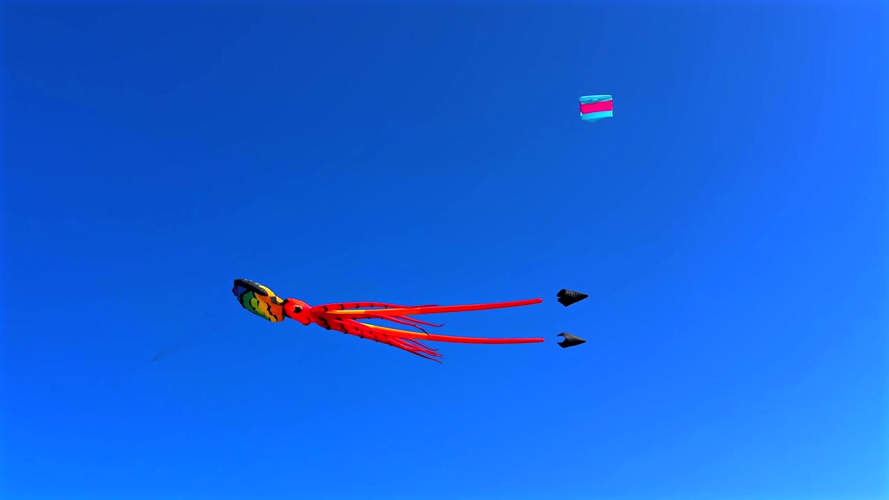 Colorful Octopus Kite Flying in Clear Blue Sky