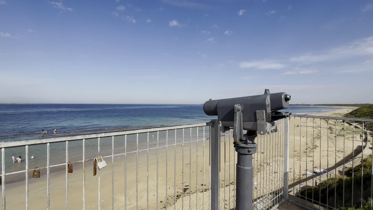 Tourist Binoculars Overlooking A Beautiful Beach At Queenscliff In Victoria, Australia.