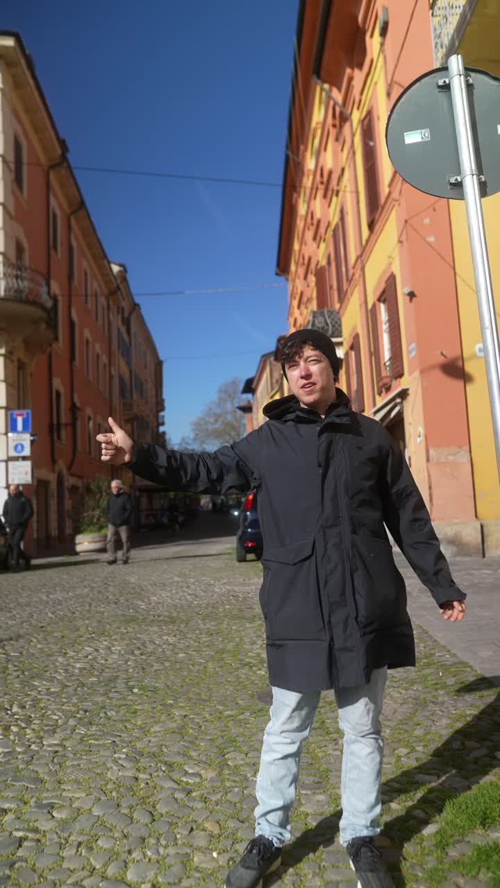 Man pointing in the street