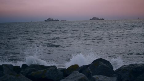 two large ships on the sun setting horizon