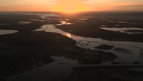 aerial view of the sun setting over ireland's beautiful landscape