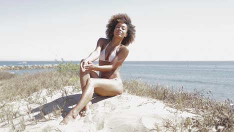 wonderful sensual girl posing on sand