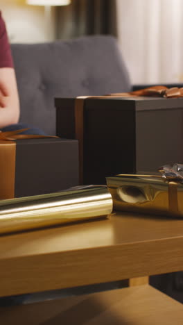 person wrapping gifts for a special occasion