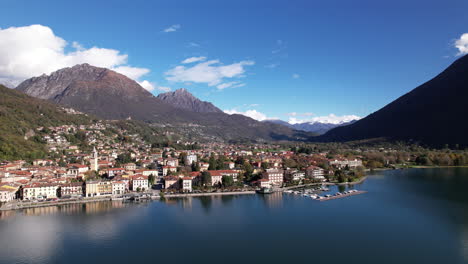 aerial view of como lake surrounded by mountains and the city of italy