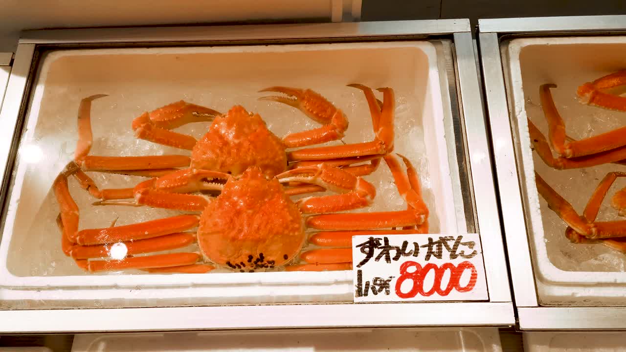 Jumbo crabs package ice box selling in fish market store, snow crabs, Nagoya, Japan.