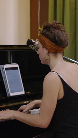 woman playing piano and singing