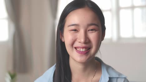 woman smile and looking at camera, video in 4k