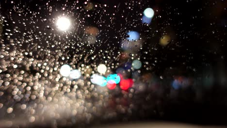 Out-of-focus-footage-of-driving-at-a-rainy-night