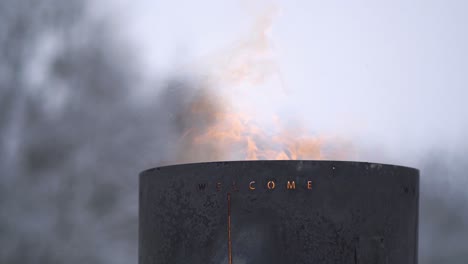 Fire-barrel-in-winter-nature-with-burning-flames