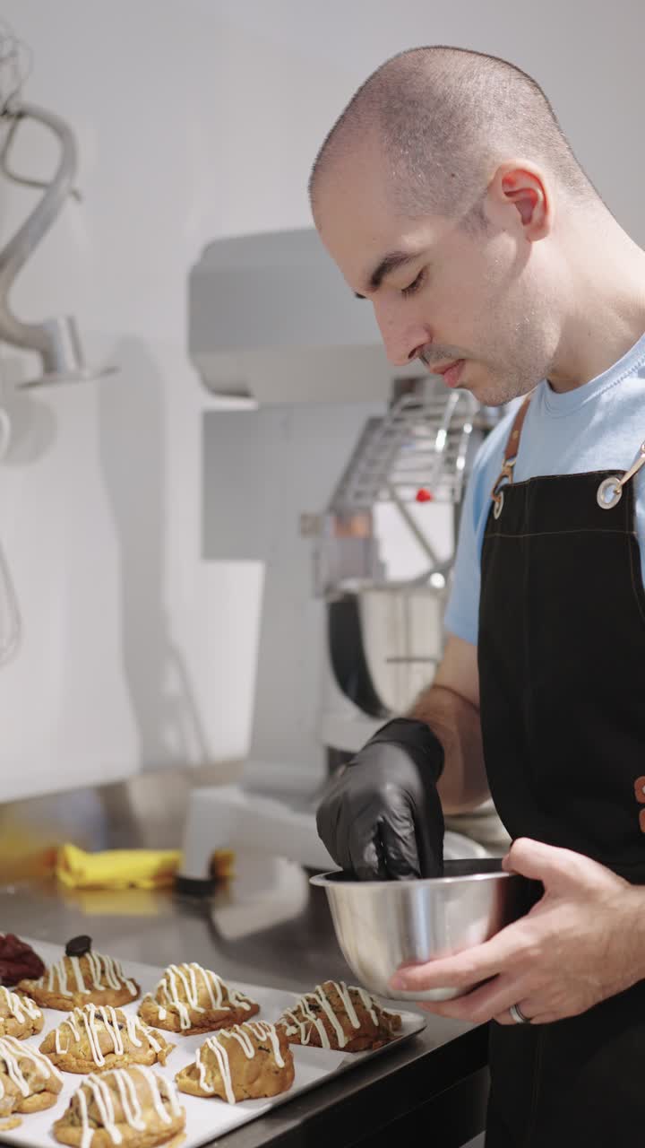 A baker preparing cookies in a kitchen