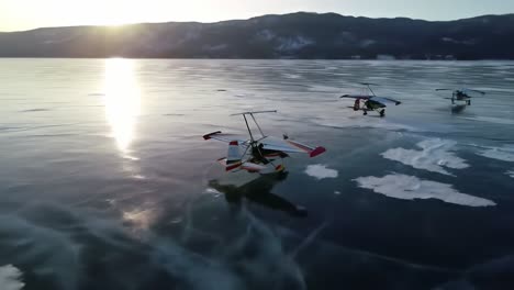 floatplanes on a frozen lake