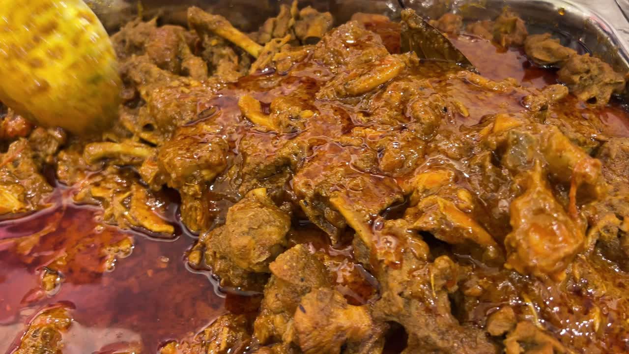 Tasty chicken kosha, a Bengali recipe in mixing bowl to be served.