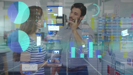 Animation-of-data-processing-over-diverse-man-and-woman-discussing-over-whiteboard-at-office