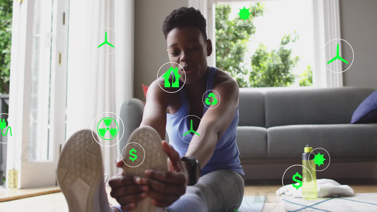 Fitness trainee on yoga mat initiating hamstring stretch by hinging hips with floating energy icons