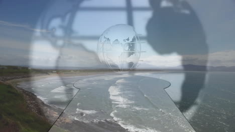 globe and keyhole animation over coastal landscape with waves and cliffs
