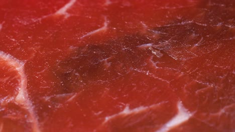 macro shot of dry or smoked red meat, detailed texture in 4k