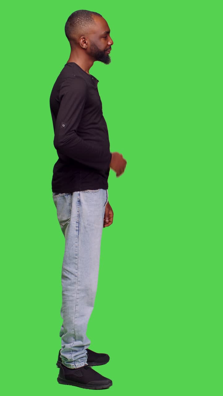 Vertical video: Profile of young adult feeling tired and yawning on camera