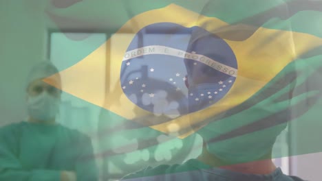 Animation-of-flag-of-brazil-waving-over-surgeons-in-operating-theatre