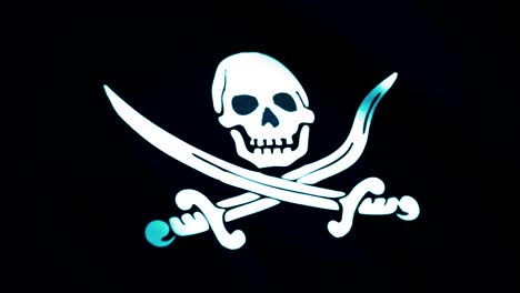 animation von piratenflagge in nahaufnahme. jolly roger ist die traditionelle englische bezeichnung für flaggen, die geflogen werden, um piratenschiffe zu identifizieren, die angreifen wollen.