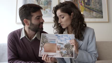 Front-view-of-two-architects-talking-with-client