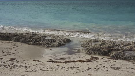 caribbean sea, atlantic ocean with mild waves with rock and small lagoon