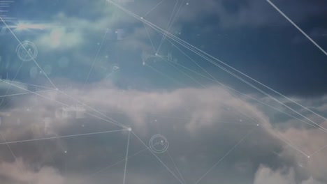 animation of network of connections and data processing against clouds in the blue sky