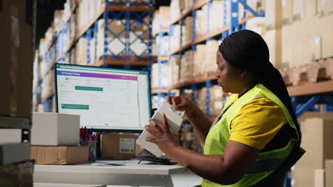 vertical video woman staff managing package labeling using shipment details adhesive tags