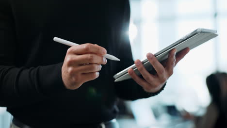 person using tablet with stylus in office