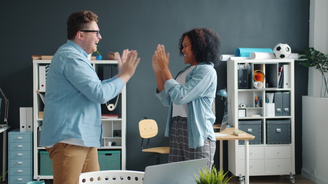 Happy Colleagues Celebrating in Modern Office