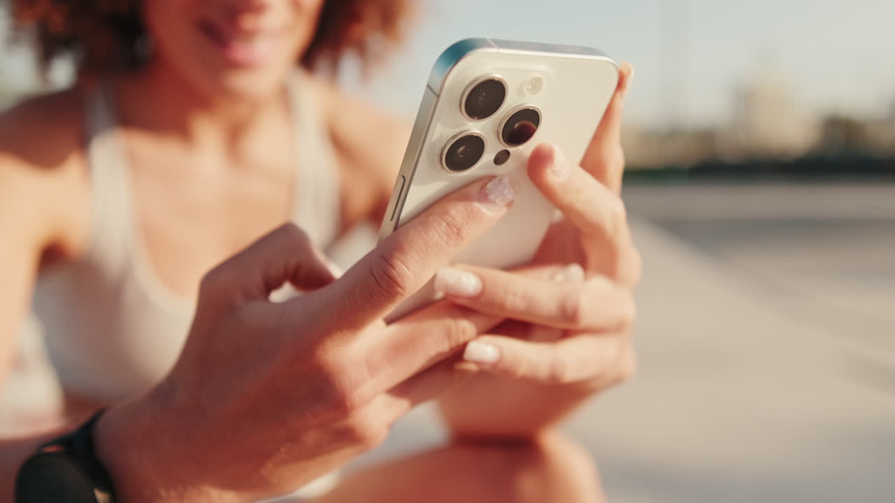 Woman Using Phone After Fitness Workout