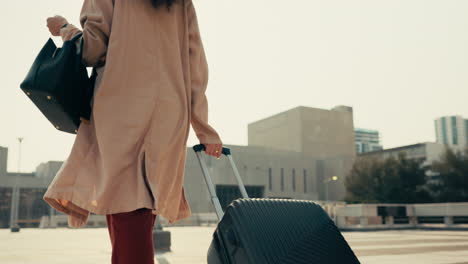 back, woman with luggage for business in city