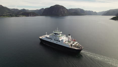 aerial bird view of a car ferry crossing a beautiful fjord in norway, lauvvika-oanes, near stavanger, summer sunny day