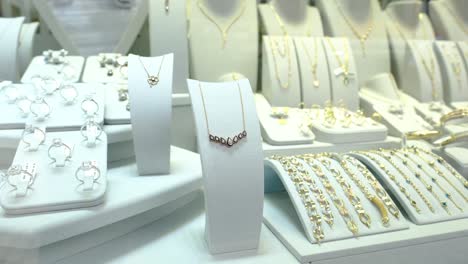 gold jewelery on jewelery stands