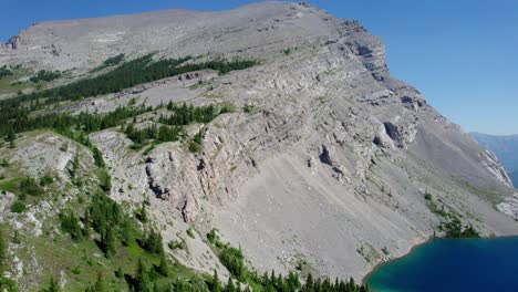 Aerial-Lifting-Shot-of-Mount-Strachan-at-Carnarvon-Lake,-Kananaskis,-Alberta,-Canada