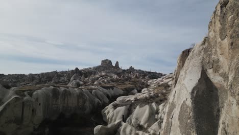 People-On-The-Rocky-Cliffs-In-Cappadocia,-Central-Turkey-Near-Göreme-During-Daytime