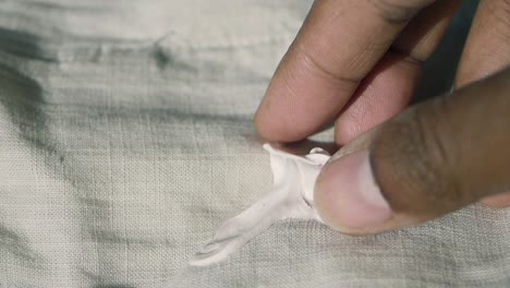 close up of white slime on a fabric surface